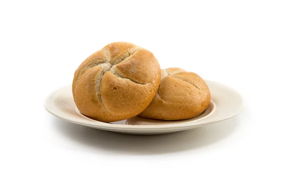 Set of two kaiser rolls on an off-white plate — Stock Photo, Image