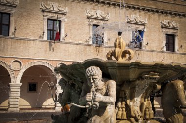 Pesaro Italy fountain in the plaza of the people clipart