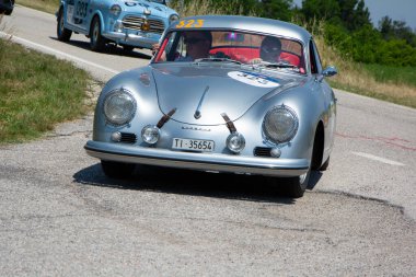 URBINO - ITALY - JUN 16 - 2022 : PORSCHE 356 1500 1954 on an old racing car in rally Mille Miglia 2022 the famous italian historical race (1927-1957