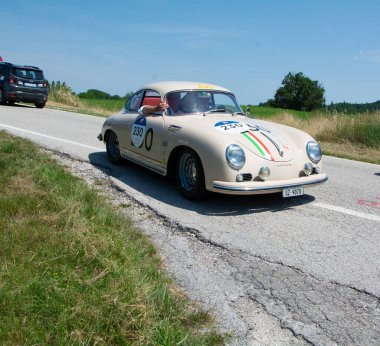 URBINO - ITALY - JUN 16 - 2022 : PORSCHE 356 A 1500 GS CARRERA 1956 on an old racing car in rally Mille Miglia 2022 the famous italian historical race (1927-1957