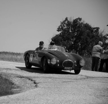 URBINO - ITALY - JUN 16 - 2022 : RAYMOND NIESEN L O.S.C.A. MT4 1350 2AD 1955 on an old racing car in rally Mille Miglia 2022 the famous italian historical race (1927-1957
