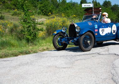 URBINO - ITALY - JUN 16 - 2022 : BUGATTI T40 1929 on an old racing car in rally Mille Miglia 2022 the famous italian historical race (1927-1957