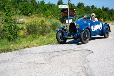 URBINO - ITALY - JUN 16 - 2022 : BUGATTI T40 1929 on an old racing car in rally Mille Miglia 2022 the famous italian historical race (1927-1957