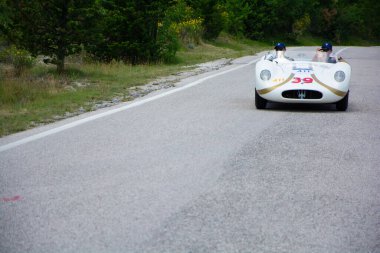 URBINO - ITALY - JUN 16 - 2022 : MASERATI 200 SI 1956 on an old racing car in rally Mille Miglia 2022 the famous italian historical race (1927-1957