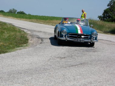 URBINO - ITALY - JUN 16 - 2022 : MERCEDES-BENZ 190 SL 1957 on an old racing car in rally Mille Miglia 2022 the famous italian historical race (1927-1957