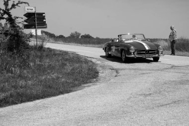 URBINO - ITALY - JUN 16 - 2022 : MERCEDES-BENZ 190 SL 1957 on an old racing car in rally Mille Miglia 2022 the famous italian historical race (1927-1957