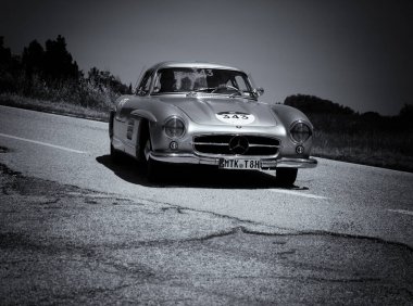 URBINO - ITALY - JUN 16 - 2022 : MERCEDES-BENZ 300 SL (W198) 1954 on an old racing car in rally Mille Miglia 2022 the famous italian historical race (1927-1957)