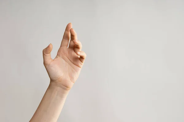 Gestos de manos. Elegante mano femenina, apuntando hacia un lado —  Fotos de Stock