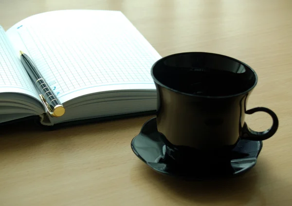 Tazza e blocco note — Foto Stock