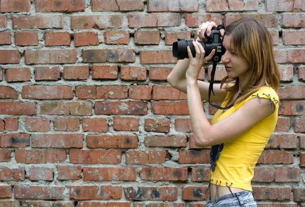 Young woman with camera — Stock Photo, Image