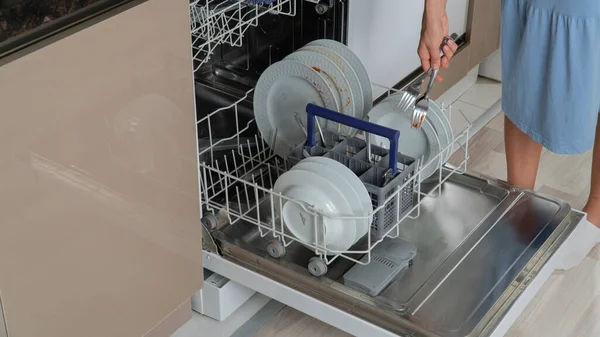 Housewife Loads Dirty Dishes Dishwasher — Stock Photo, Image