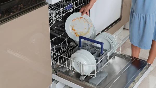 Housewife Puts Dirty Dishes Dishwasher — Stock Photo, Image