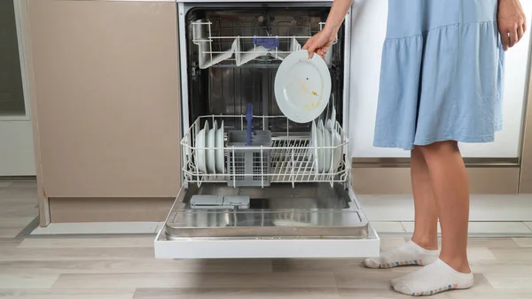 Housewife Puts Loading Dirty Dishes Dishwasher Front View — Stock Photo, Image