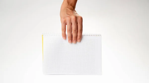 Hand Holds Notebook Cage Descends White Background High Quality Photo — Stock Photo, Image