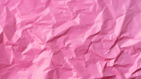 Kırışık renkli kağıt arka plan dokusu dolgun pembe. Yüksek kalite fotoğraf