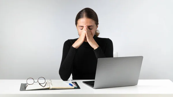 Tired woman after hard work at the laptop. High quality photo