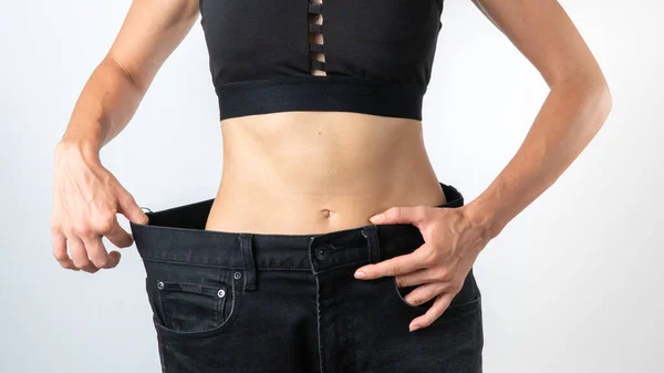 Kvinna Byxor Storlek Större Viktminskning Smal Kropp Efter Bantning Högkvalitativt — Stockfoto