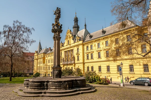 Fountain with column and statue of St.Joseph — Stock Photo, Image