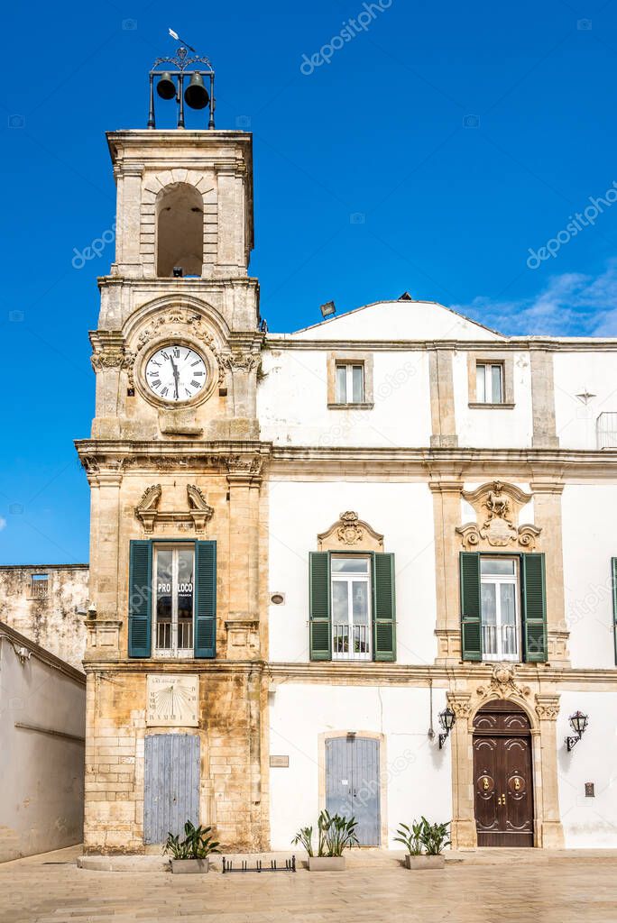 Vie wat the Clock tower in the streets of Martina Franca town in Italy