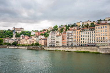 LYON, FRANCE - JUNE 26,2022 - View at the buildings near waterfront of Saone river in Lyon. Lyon is the third-largest city and second-largest metropolitan area of France.