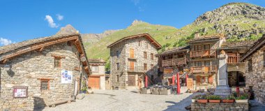 BONNEVAL, FRANCE - JUNE 28,2022 - Panoramic view at the Stone buildings in Bonneval-sur-Arc village. Bonneval-sur-Arc is a commune in the Savoie department in south-eastern France.