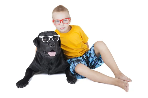 Boy with a dog with glasses — Stock Photo, Image