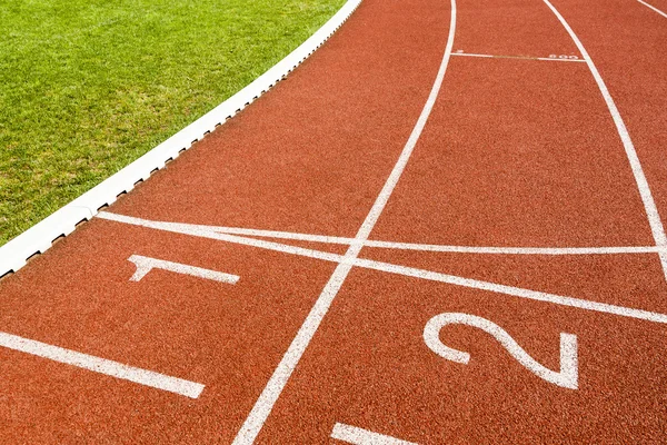 White lines and numbers on the track of stadium. — Stock Photo, Image