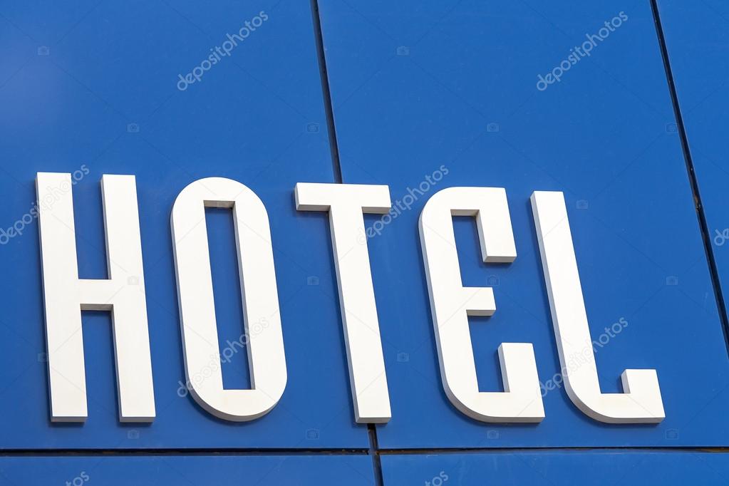 Inscription hotel on blue wall.