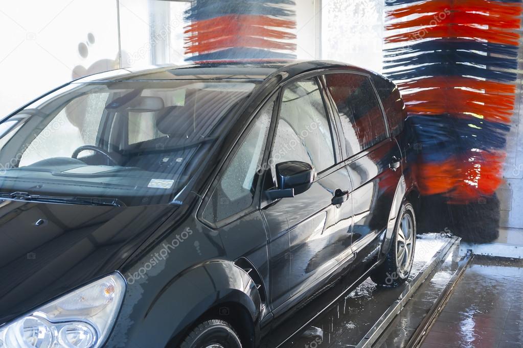 Car wash, car in automatic car wash.