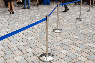 Metal barriers separating people at the concert. clipart