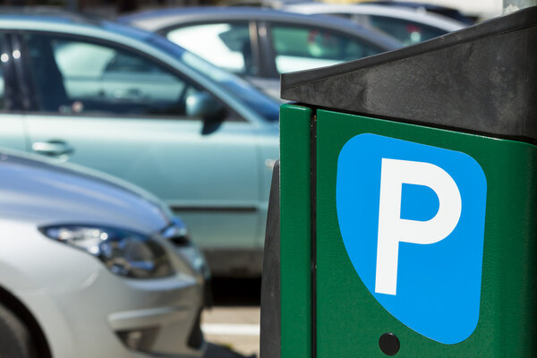 Paid parking for cars in city.