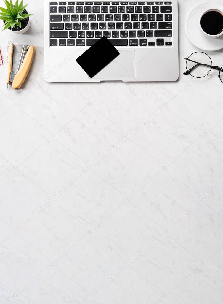 Online payment concept, mock up credit card with office desk computer isolated on beautiful marble background, workspace design, topview, flatlay, copyspace.