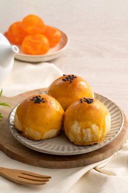 Design concept of Moon cake yolk pastry, mooncake for Mid-Autumn Festival holiday on wooden table background