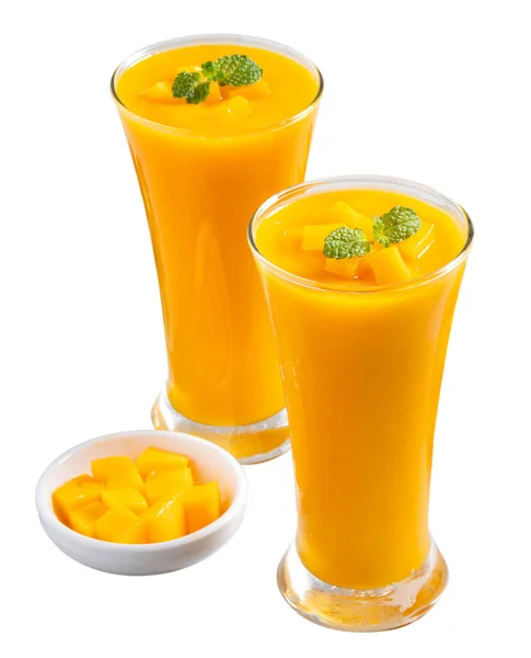 Fresh beautiful delicious mango juice. Close up design concept of smoothie cold drink in glass cup with glass straw isolated on white background.
