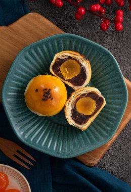 Design concept of Moon cake yolk pastry, mooncake for Mid-Autumn Festival holiday on gray table background