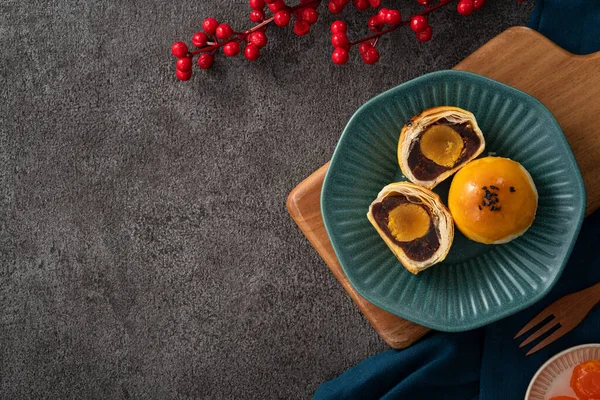 Design concept of Moon cake yolk pastry, mooncake for Mid-Autumn Festival holiday on gray table background