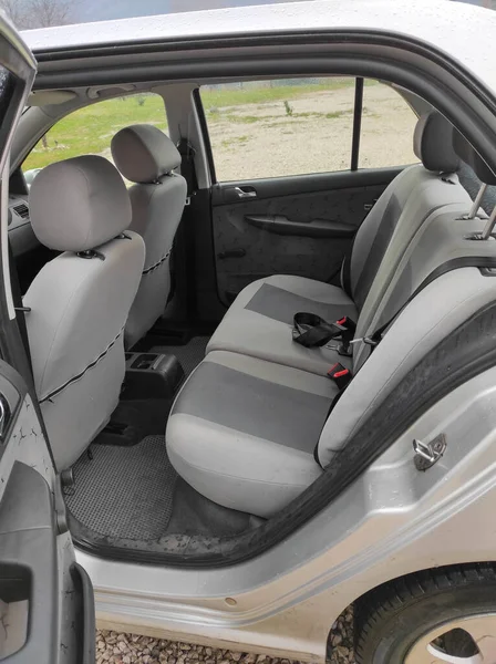 Rear seats.The rear passenger seat is wide and clean. Fabric interior, side view, black