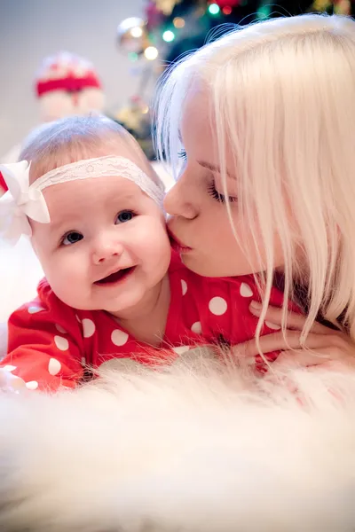 Christmas baby girl with blond hair mother — Stock Photo, Image