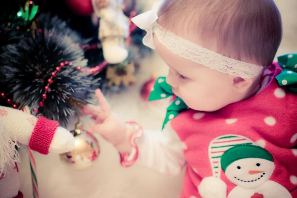 Christmas babygirl with snowman and candy — Stock Photo, Image