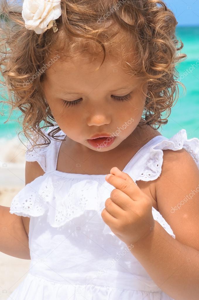 Little two year old girl at the beach