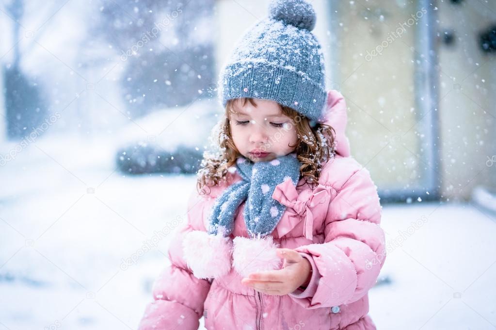 Cute Baby Girl In Pink Jacket And Grey Hat Enjoying First Snow B