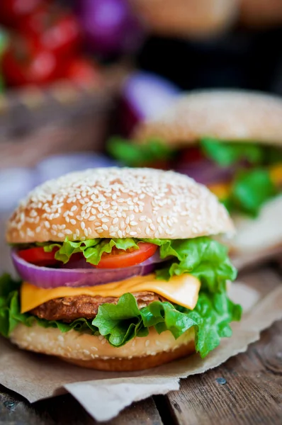 Closeup of home made burgers on wooden background — Stock Photo, Image