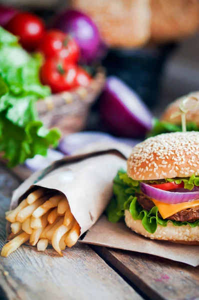 Closeup of home made burgers on wooden background — Stock Photo, Image