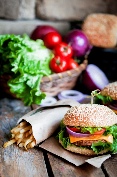 Closeup of home made burgers on wooden background — Stock Photo, Image