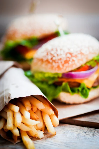 Closeup of home made burgers on wooden background — Stock Photo, Image