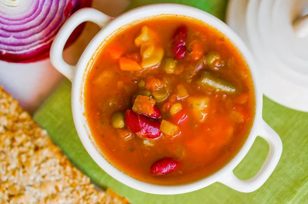 Minestrone soup on wooden background — Stock Photo, Image