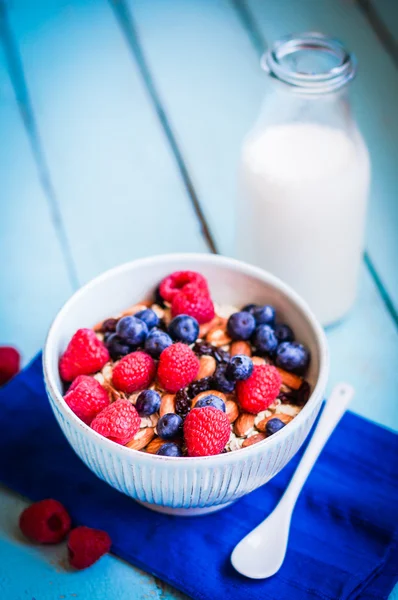 Granola with berries and almonds in a bowl — Stock Photo, Image