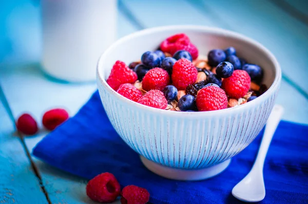 Granola with berries and almonds in a bowl — Stock Photo, Image