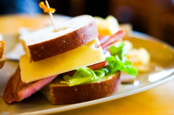 Club sandwich with ham and cheese — Stock Photo, Image