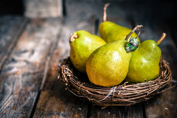 Pears on rustic wooden background — Stock Photo, Image